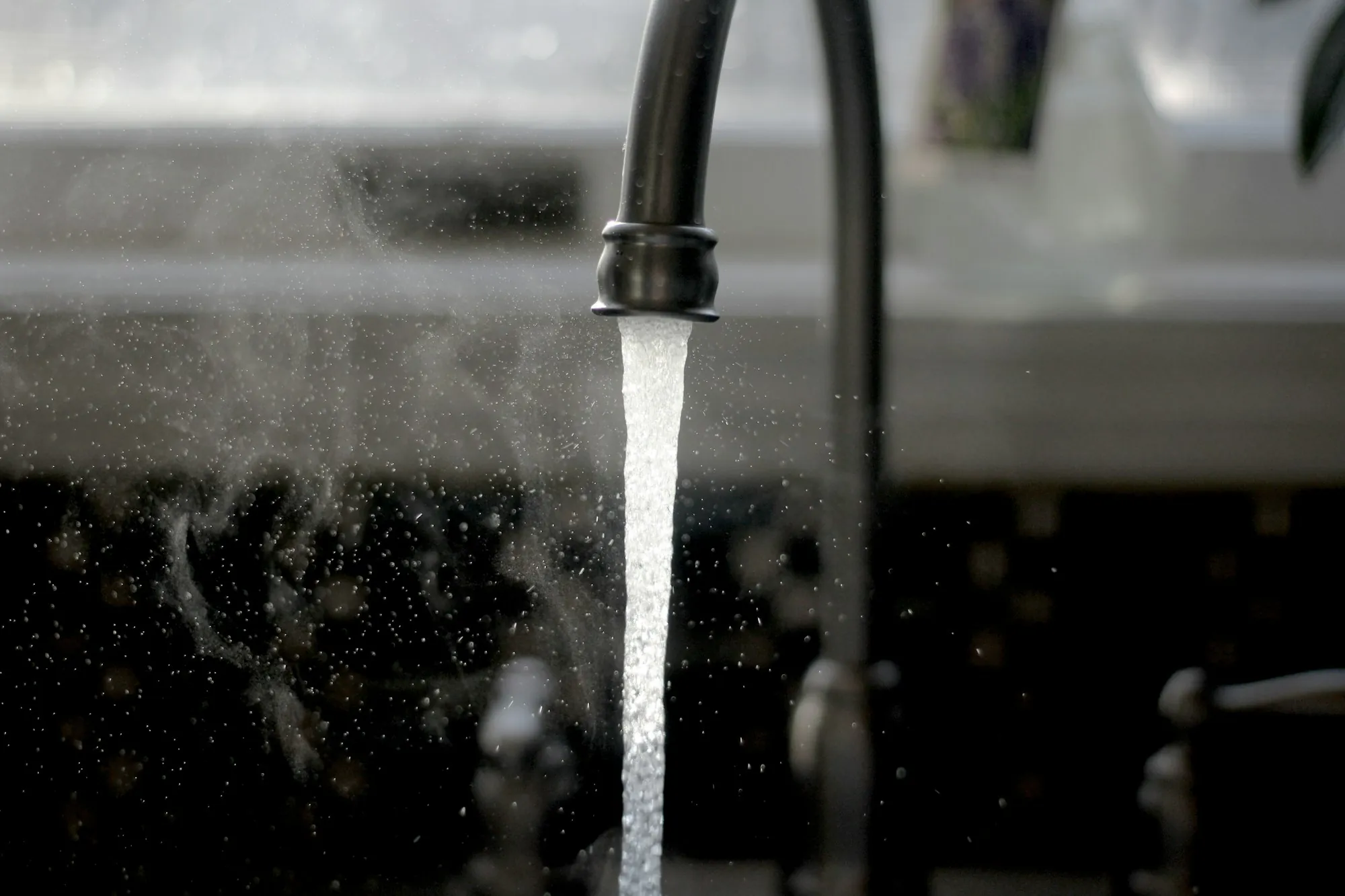 Water running from a kitchen sink faucet